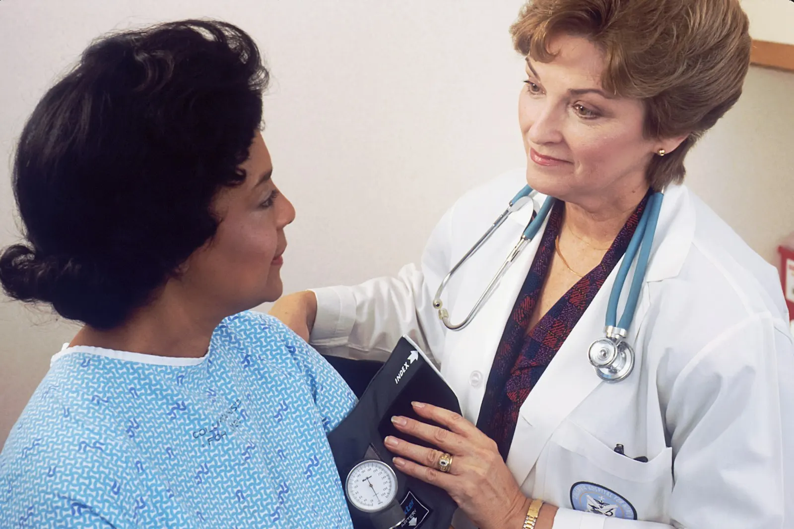 Doctor checking a patient’s blood pressure