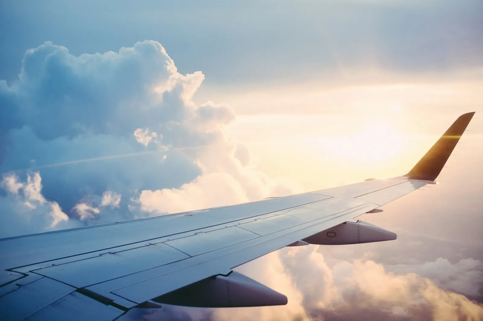 View of clouds and sunset from an airplane window